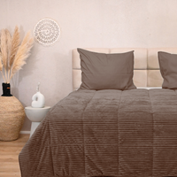 Brown HappyBed Rib duvet on bed, offers year-round comfort with microfibre and teddy textures, suitable for all seasons.