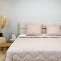 HappyBed Premium Dune light pink percal cotton summer duvet on bed with beige headboard and neutral bedroom decor