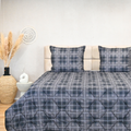 HappyBed Grey tartan all-season grey tartan quilted bedspread with matching pillows in modern bedroom setting