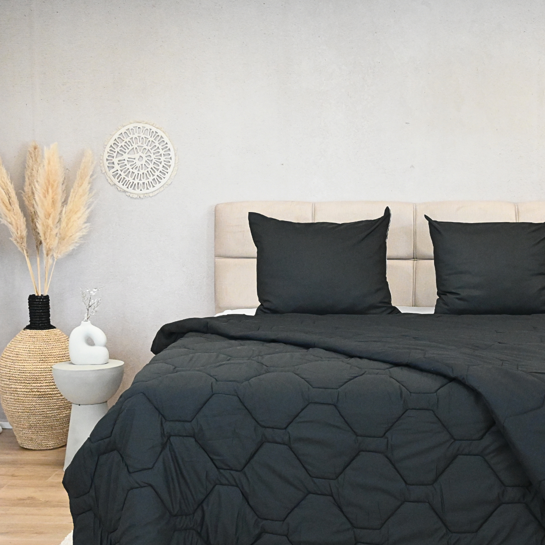 HappyBed Black adjustable duvet, luxurious four-season bedding on modern bed setup.