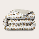 Colorful double-faced HappyBed x A Fish Named Fred Coffee Dream duvet designed for year-round comfort and style