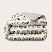 Colorful double-faced HappyBed x A Fish Named Fred Coffee Dream duvet designed for year-round comfort and style