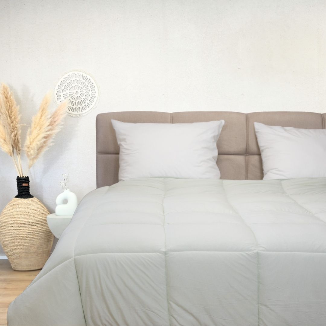 HappyBed Jersey light green hypoallergenic breathable year-round duvet on bed with pillows and neutral decor