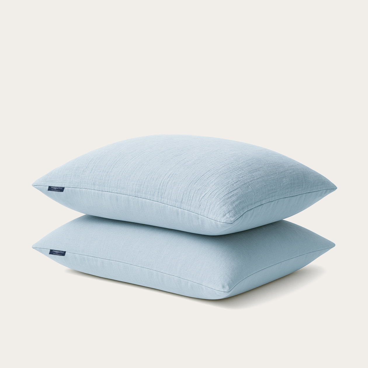 Set van 2 HappyBed Mousseline kussenslopen in lichtblauw met zachte, lichte microvezel en praktische hotelsluiting voor luxe comfort en stijl.