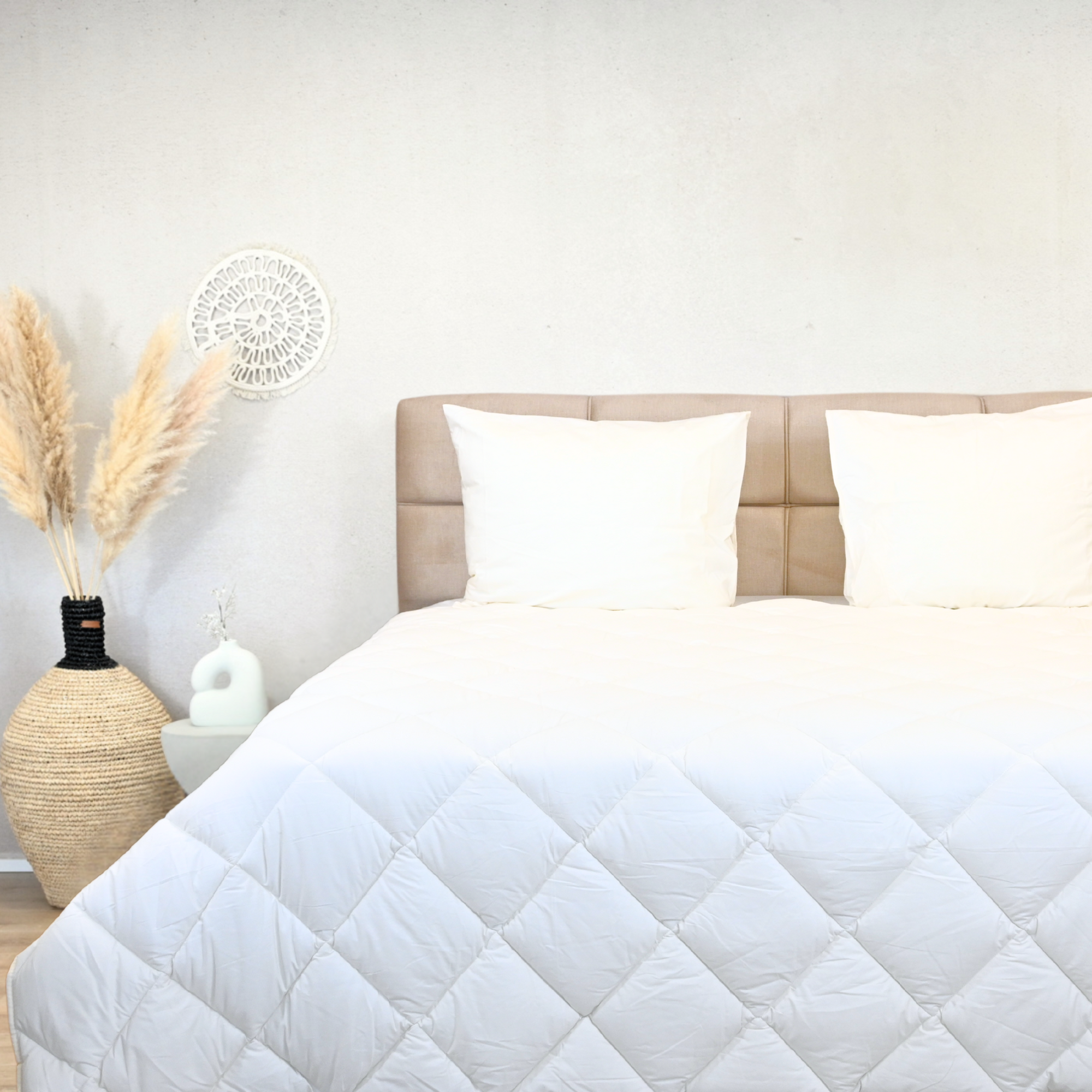 Off-white percal cotton duvet for all seasons on a bed with neutral decor.