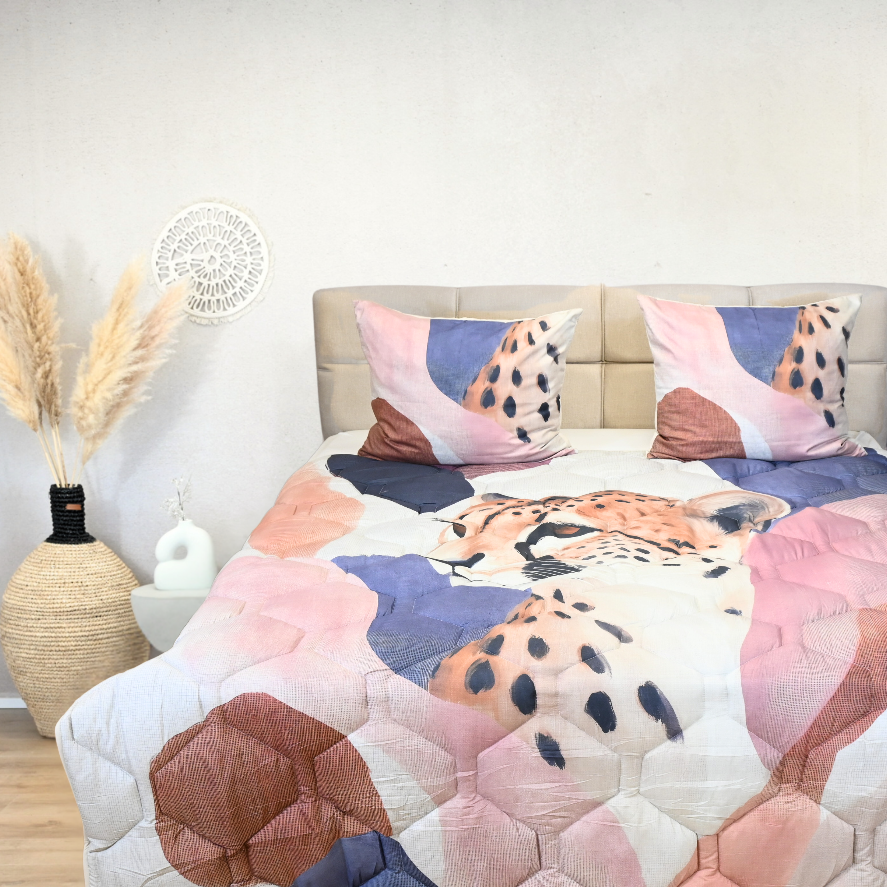 HappyBed Vivid Chase all-season duvet with cheetah print on a bed, featuring soft microfiber and hypoallergenic materials.
