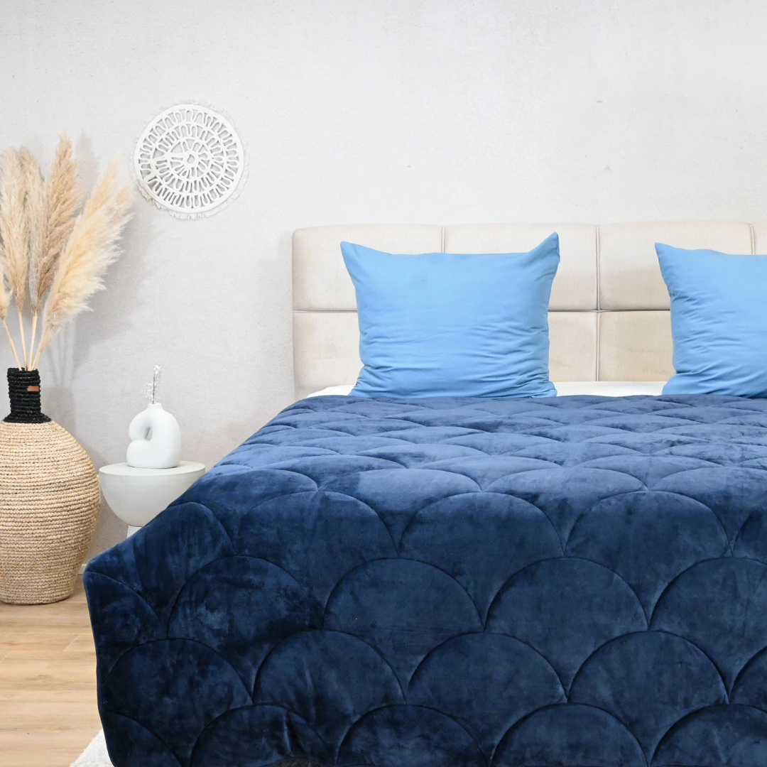 HappyBed velvet Big Dipper year-round duvet on a bed with blue pillows.