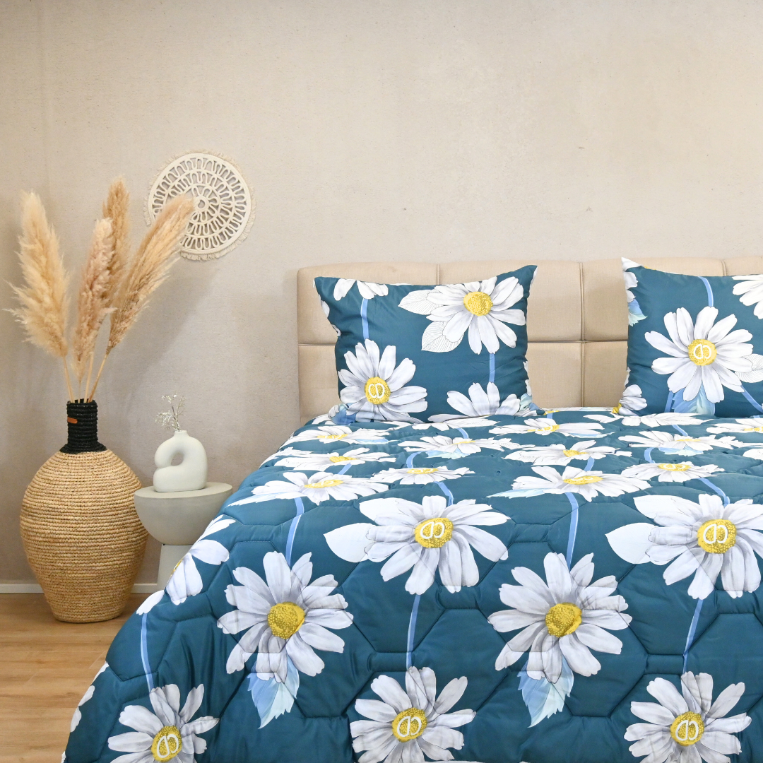 Sunflower-patterned satin look duvet on bed with matching pillows, ideal for all seasons.