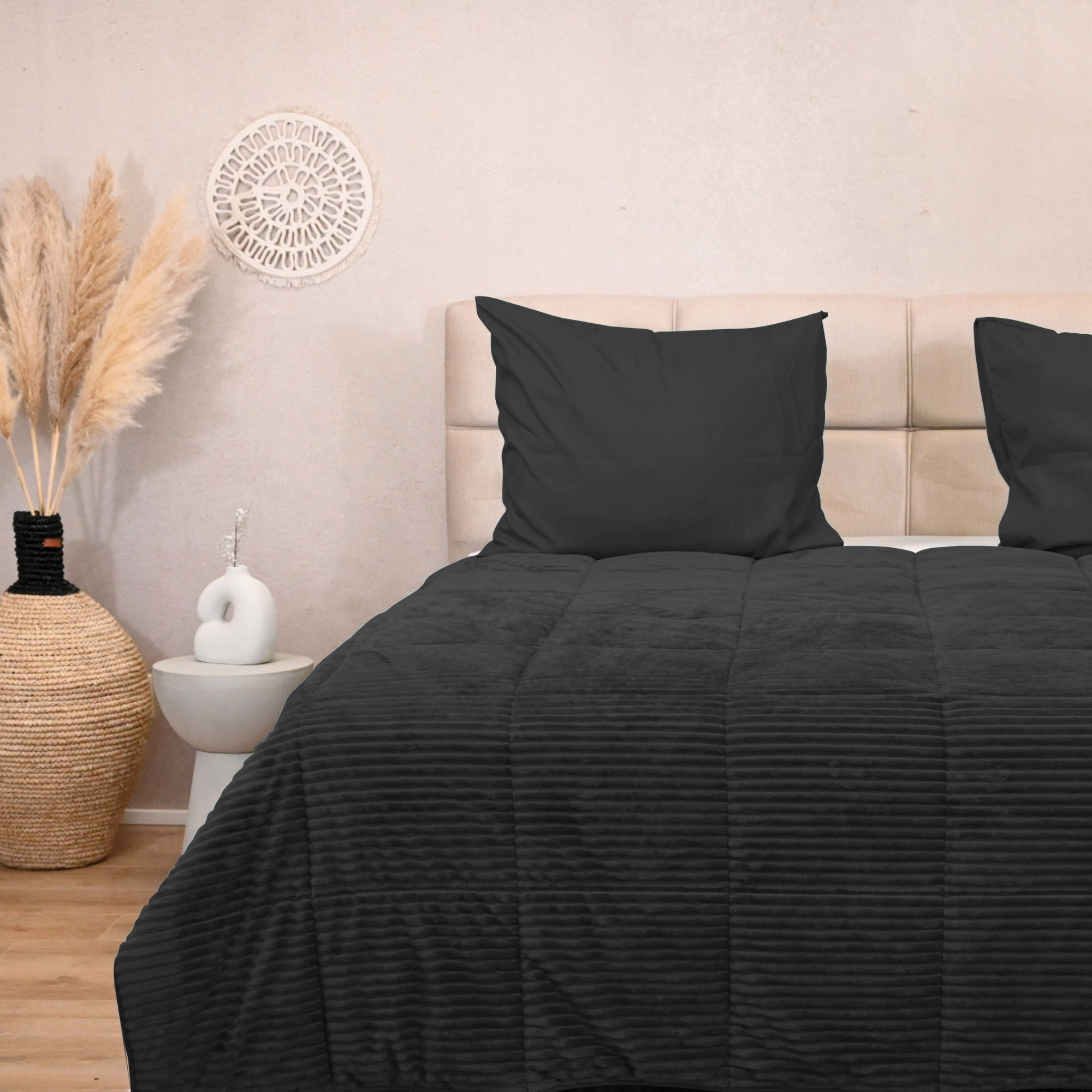 HappyBed Rib Black all-season duvet on bed in cozy room setting