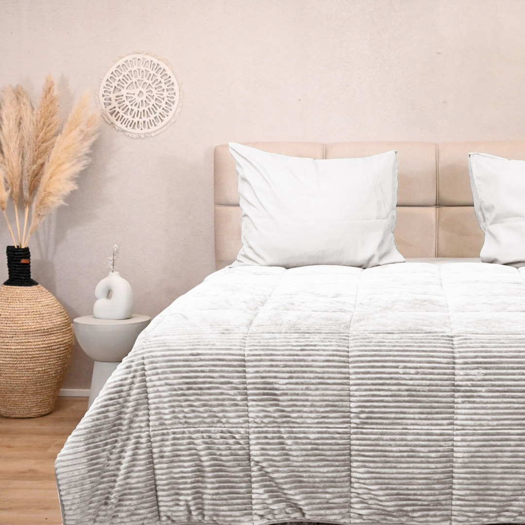 HappyBed Snow White all-season duvet on bed, luxuriously designed for comfort and warmth.