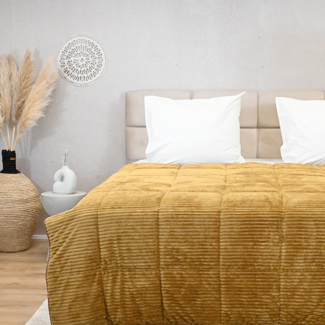 HappyBed Rib bronze brown all-season duvet on bed, offering cozy and hypoallergenic comfort.