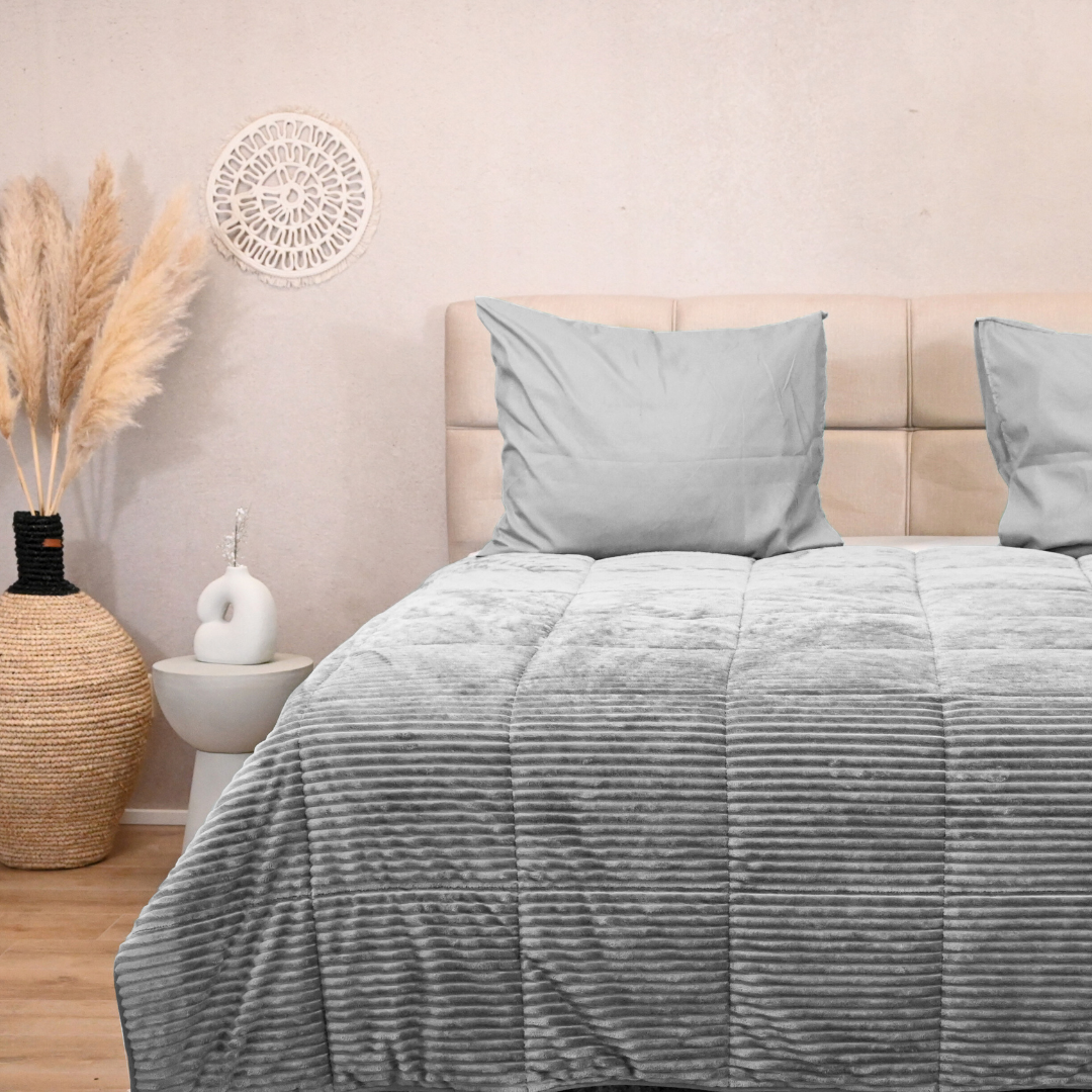 HappyBed Rib Silver Grey all-season duvet on a bed.