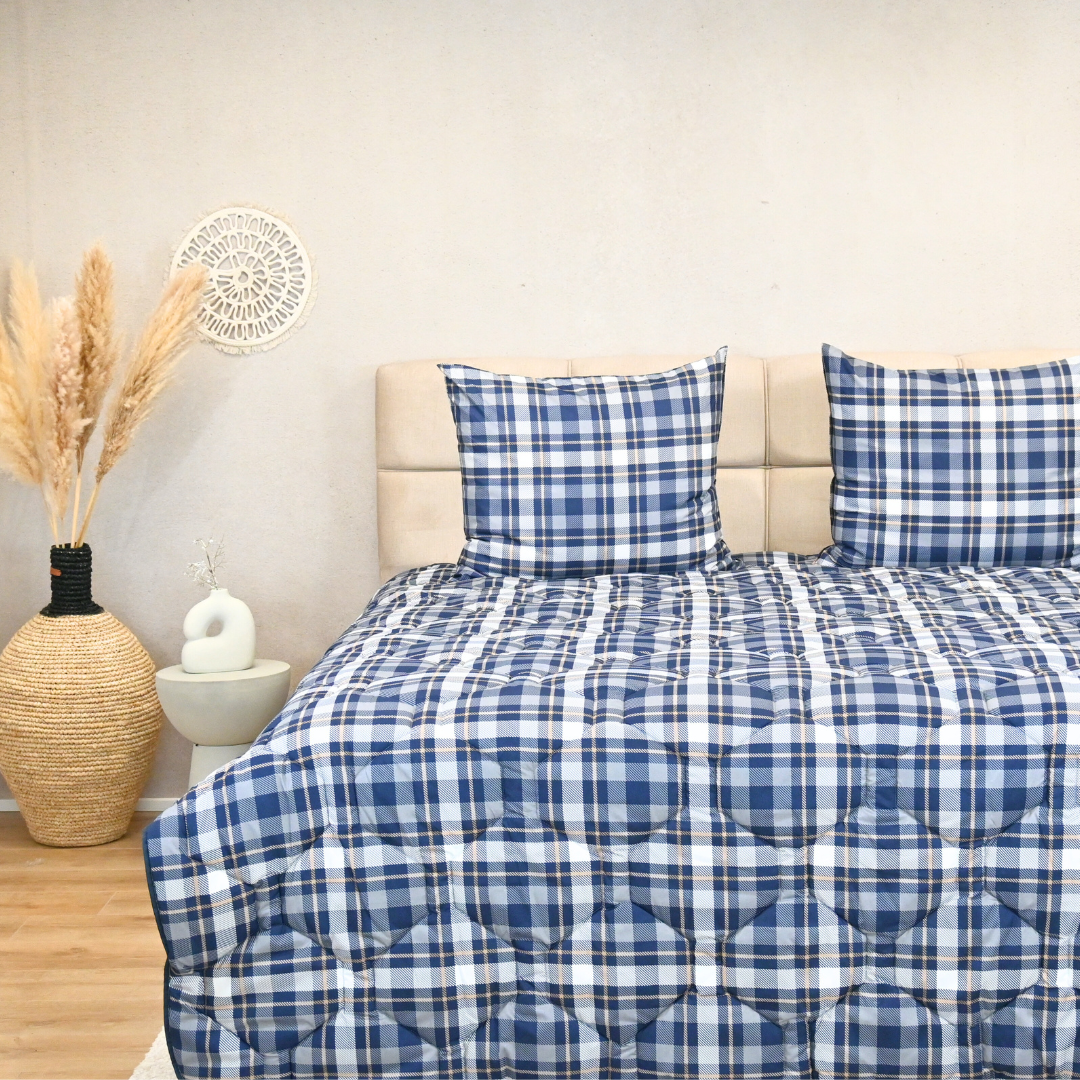 HappyBed Tartan all-season comfortable duvet with plaid design on a neatly made bed.