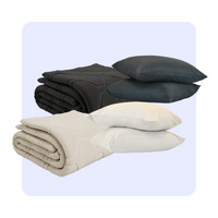 HappyBed Bestseller Set with two year-round comforters in taupe and black, including matching pillowcases.