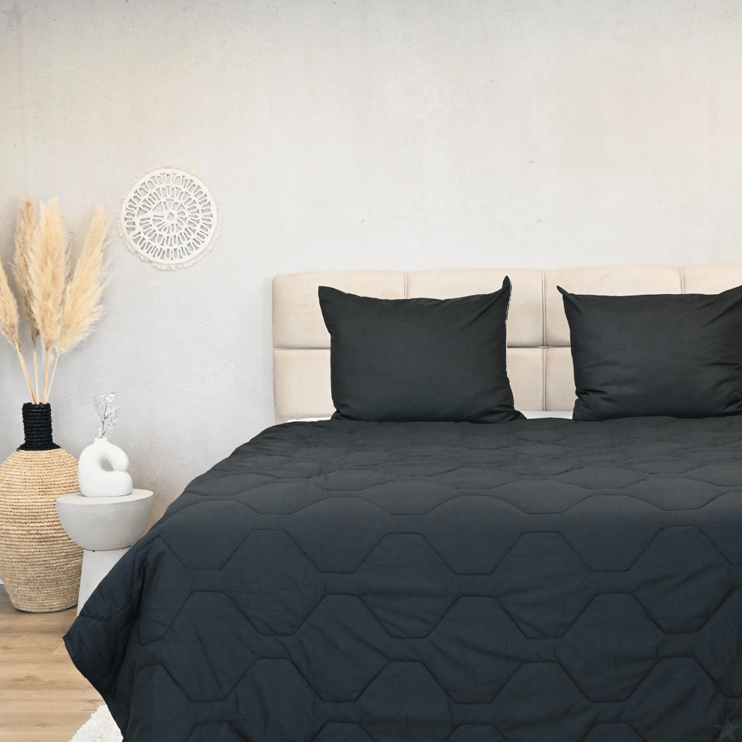 HappyBed Black summer duvet on bed for warm nights, hypoallergenic and lightweight.