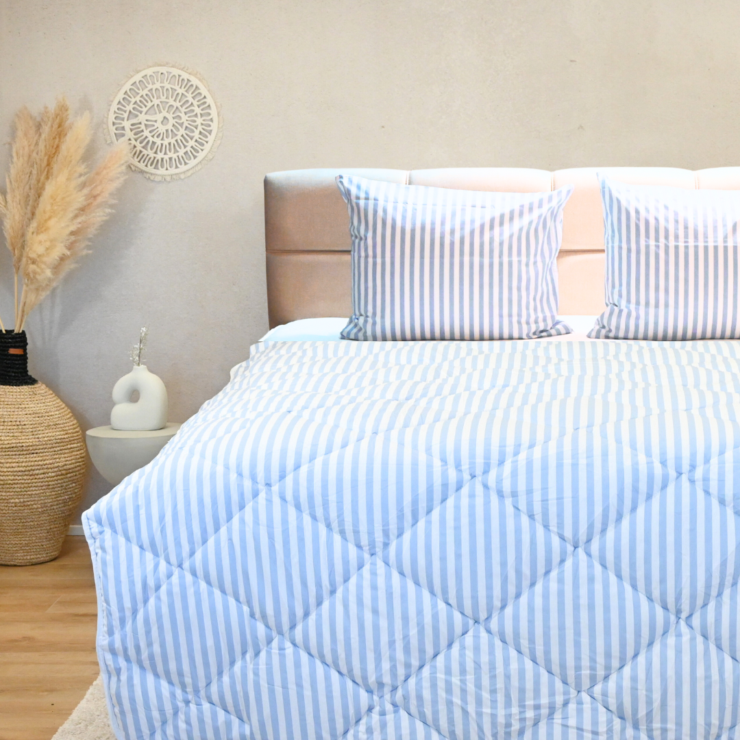 HappyBed Coastal Breeze 100% cotton year-round duvet on bed.