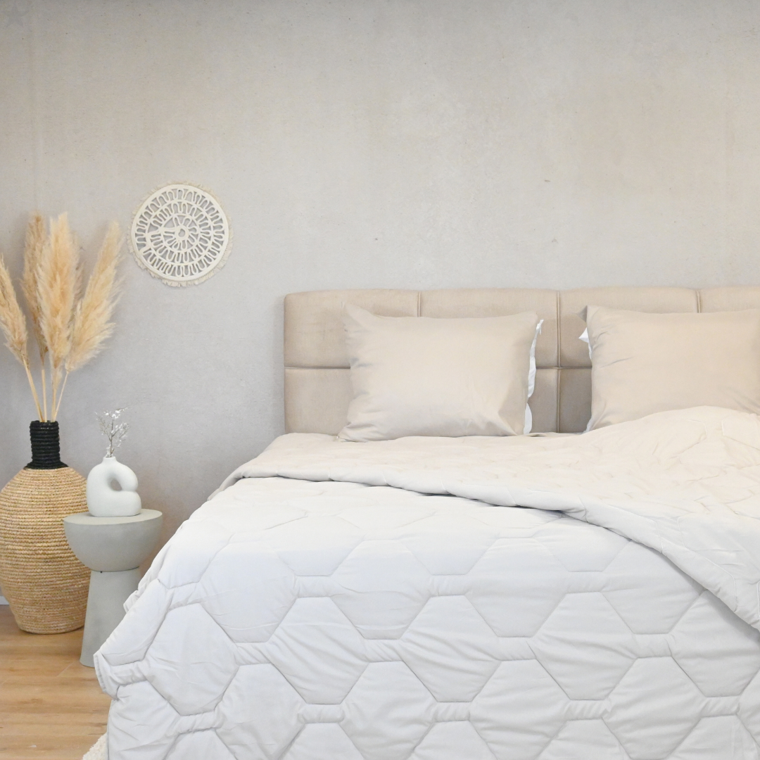 HappyBed Taupe adjustable 4-season duvet in a modern bedroom setting.