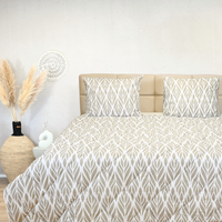 HappyBed Gentle waves all-season cotton duvet on bed with matching pillows.